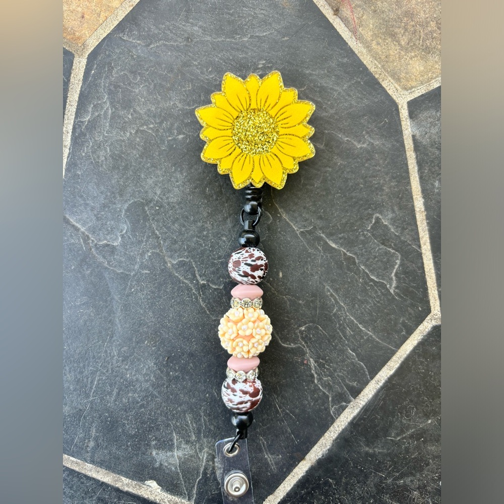Sunflower badge reel